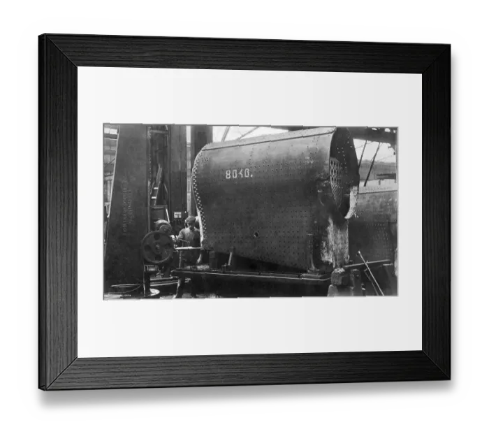 Framed Print : Construction of a locomotive, drilling stud holes on the boiler