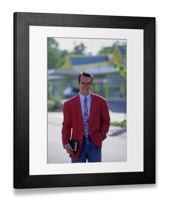 Framed Print : Young man with diary and red jacket
