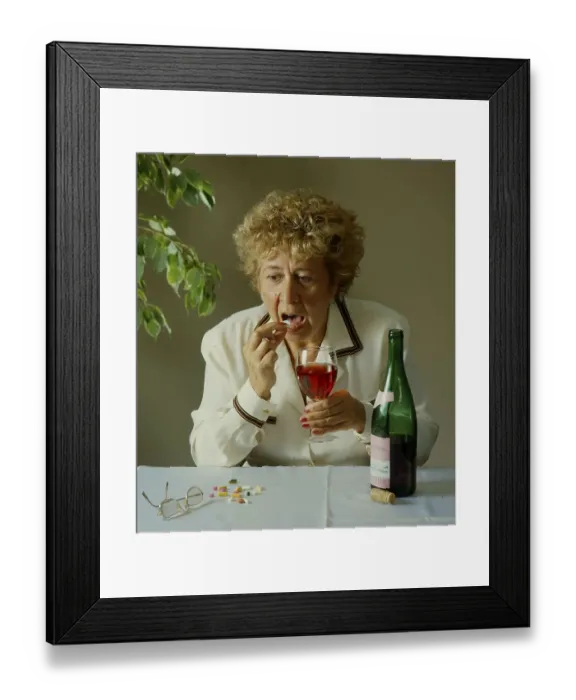 Framed Print : Older woman with wine glass and bottle Framed Print : Older woman with wine glass and bottle