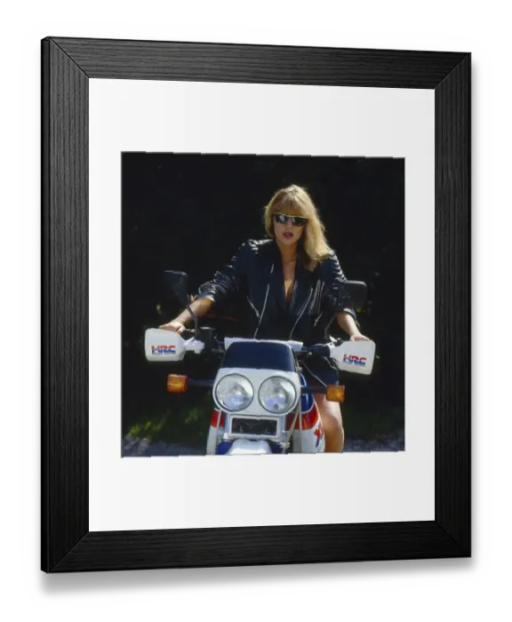 Framed Print : Young Blonde Woman with Black Leather Jacket on a Motorcycle Framed Print : Young Blonde Woman with Black Leather Jacket on a Motorcycle