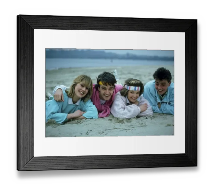 Framed Print : Young people lying on the beach 2 couples
