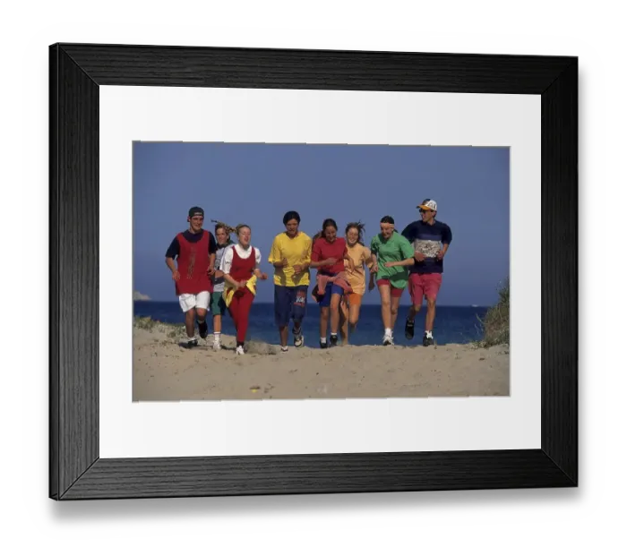 Framed Print : Young people at the beach run Group of 8