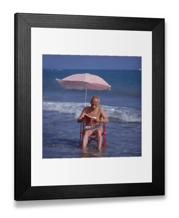 Framed Print : Older man in the solar chair and sunshade in the sea Framed Print : Older man in the solar chair and sunshade in the sea
