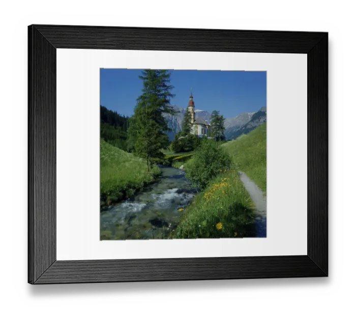 Framed Print : Church, stream and spring meadow in Obernberg am Brenner Framed Print : Church, stream and spring meadow in Obernberg am Brenner