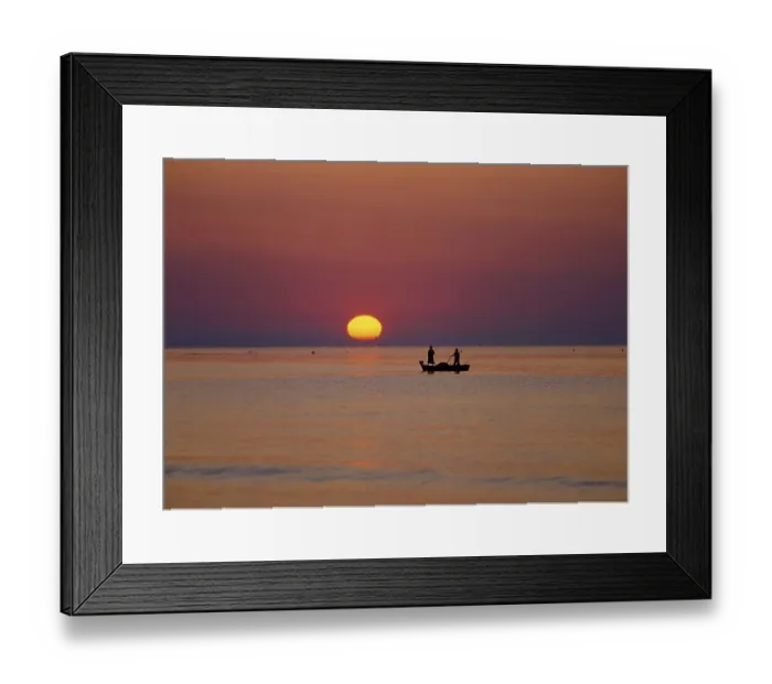 Framed Print : Fishing boat on the sea in the sunset