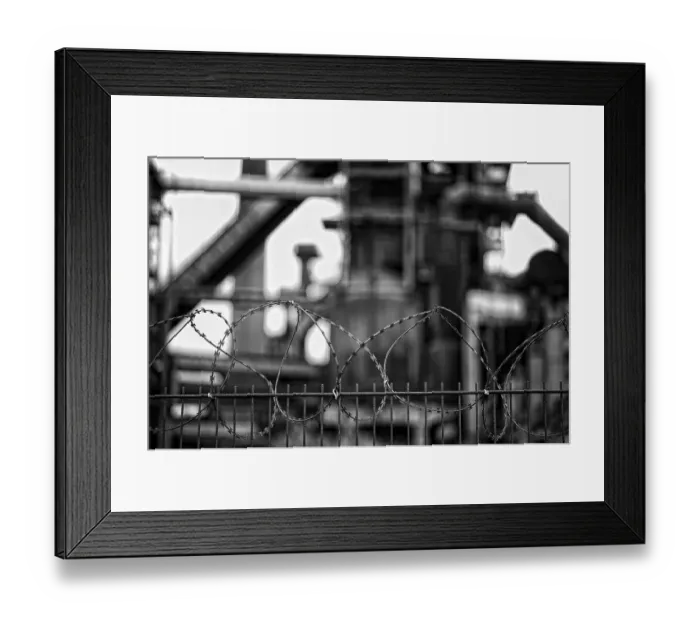 Framed Print : Barbed wire fence, former Phoenix West steelworks