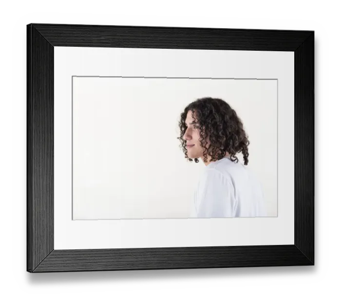 Framed Print : Portrait of a young man dressed in white yoga clothes over white background