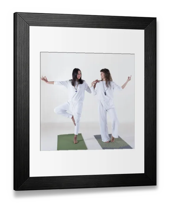 Framed Print : Two women dressed in white doing yoga over white background