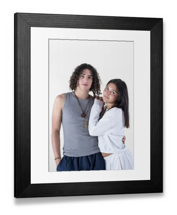 Framed Print : Portrait of a young couple dressed in yoga clothes looking ti the camera white background Framed Print : Portrait of a young couple dressed in yoga clothes looking ti the camera white background