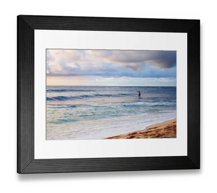 Framed Print : Young man stand up paddling in the sea