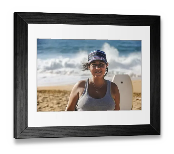 Framed Print : Portrait of smiling woman looking at the camera at the beach Framed Print : Portrait of smiling woman looking at the camera at the beach