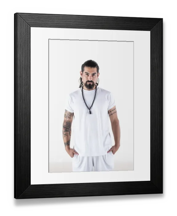 Framed Print : Portrait of a man dressed in white yoga clothes over white background while looking at camera