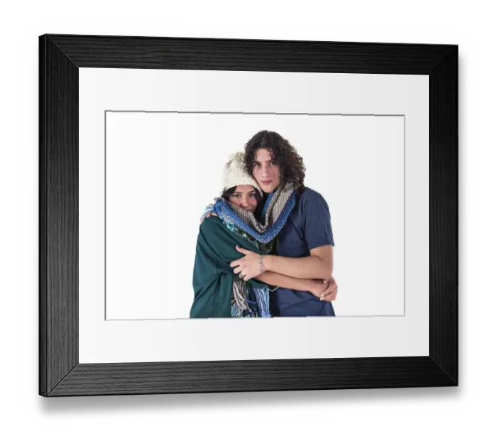 Framed Print : Two friends are hugging each other like they are cold while wearing the same scarf Framed Print : Two friends are hugging each other like they are cold while wearing the same scarf