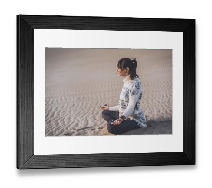 Framed Print : Side view of a woman clasping hands at the beach