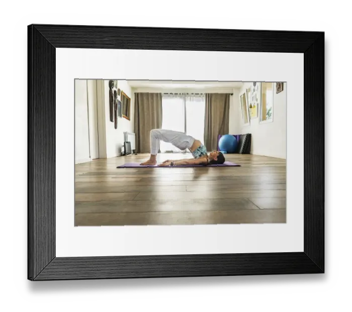 Framed Print : Side view of a woman practicing yoga