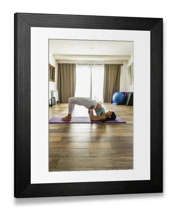 Framed Print : Side view of a woman practicing yoga