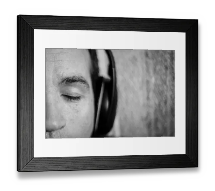 Framed Print : A close up of a mans face with his eyes closed