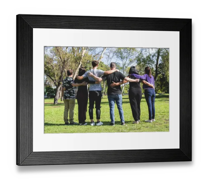 Framed Print : Rear view of a group of hugging friends Framed Print : Rear view of a group of hugging friends