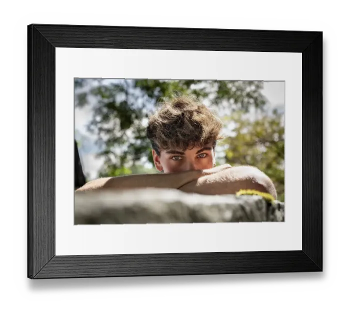 Framed Print : Young man falls his head down on his arms