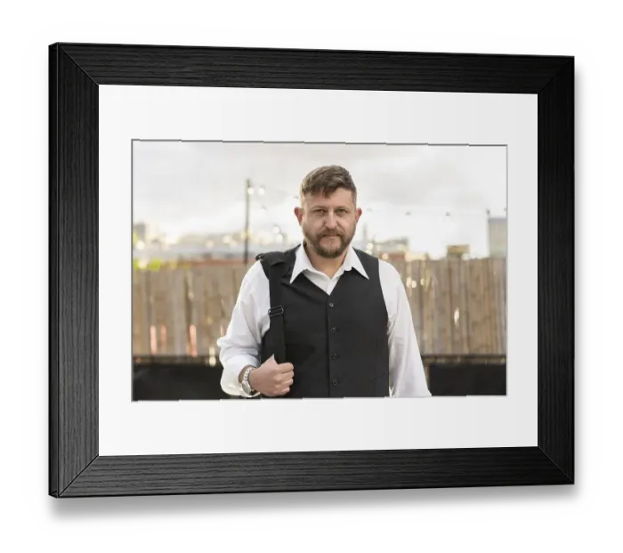 Framed Print : Portrait of an attractive businessman looking at camera before an after office Framed Print : Portrait of an attractive businessman looking at camera before an after office