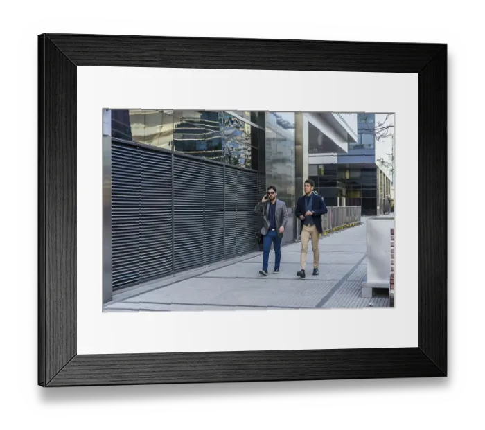 Framed Print : Two business colleagues are walking on the street