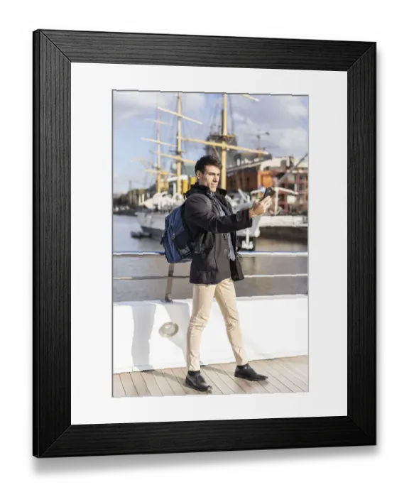 Framed Print : Handsome tourist taking selfies in Puerto Madero
