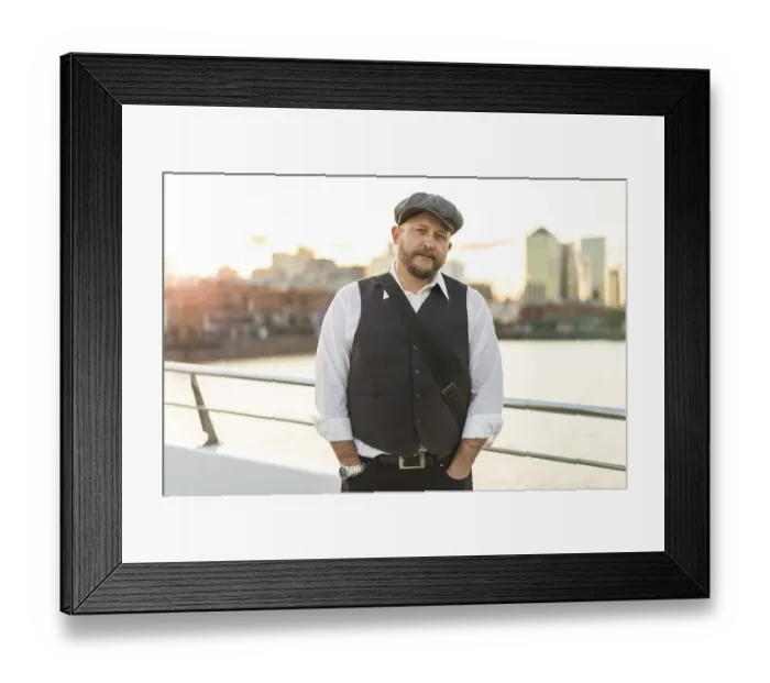 Framed Print : Portrait of a musician looking at camera at sunset Framed Print : Portrait of a musician looking at camera at sunset