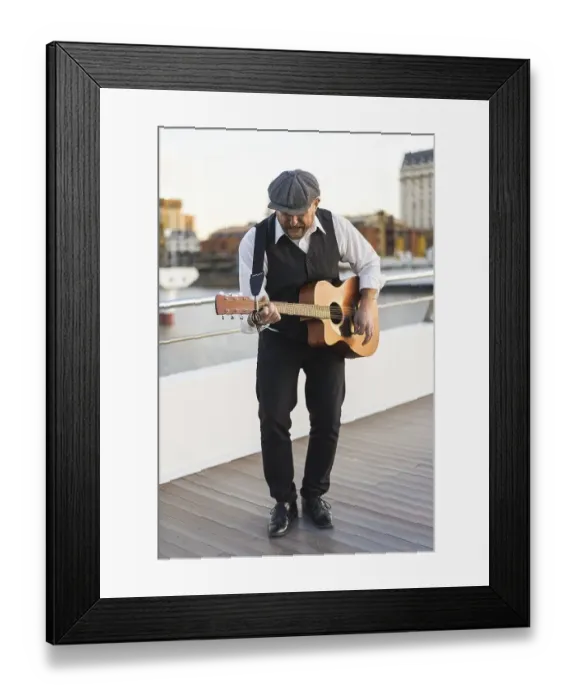 Framed Print : Guitar musician playing guitar in the street