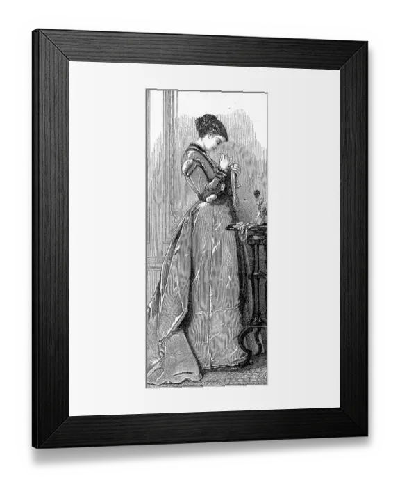 Framed Print : Woman at sewing work, in a long dress after the fashion around 1869 in France