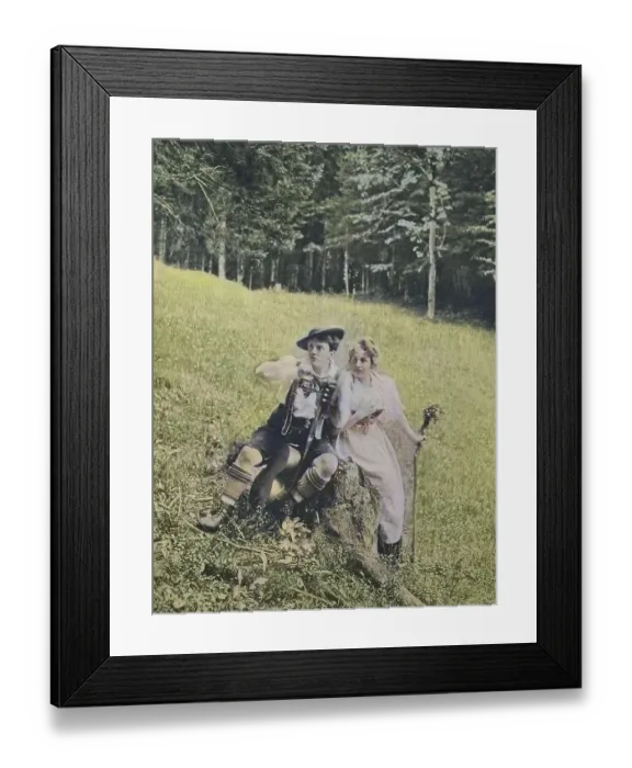 Framed Print : Young couple in alpine traditional costume