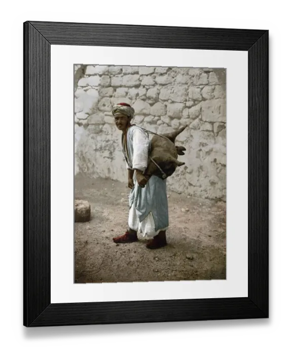 Framed Print : Water carrier, water seller with a goat bellows in Jerusalem