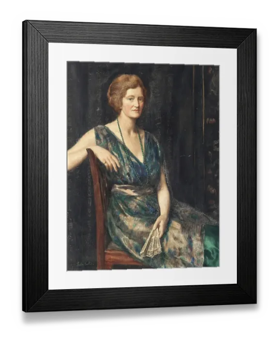 Framed Print : A woman in elegant dress sits in an armchair and holds a fan