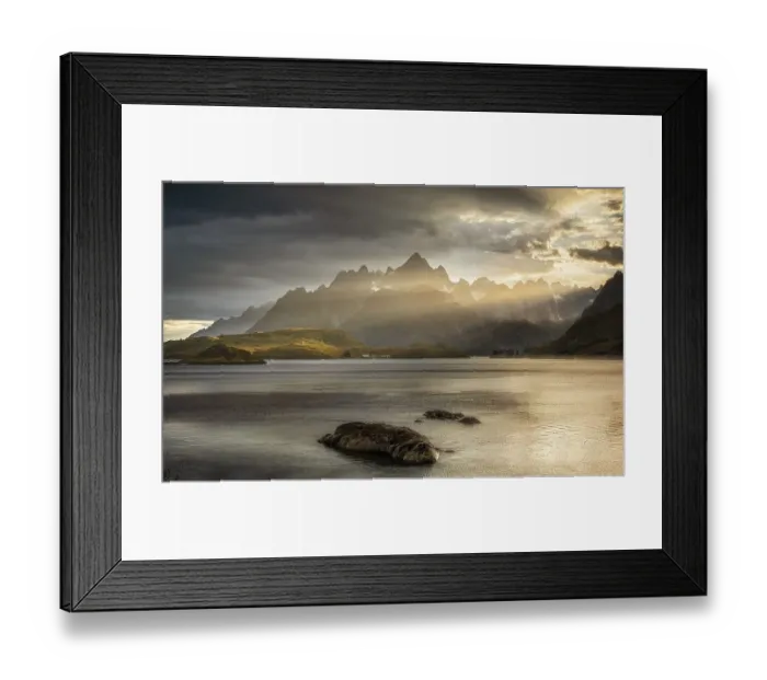 Framed Print : Rugged peaks of the mountain range Trolltindan in the rays of the evening sun