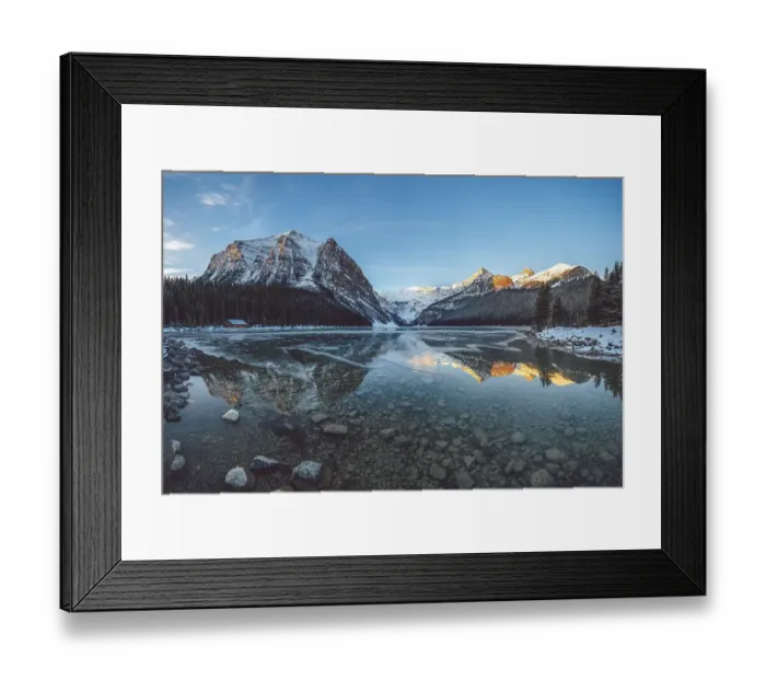 Framed Print : Peaceful lake reflecting snow-capped mountains and a cabin under a clear blue sky at sunrise, Lake Louise, Canadian Rockies Framed Print : Peaceful lake reflecting snow-capped mountains and a cabin under a clear blue sky at sunrise, Lake Louise, Canadian Rockies