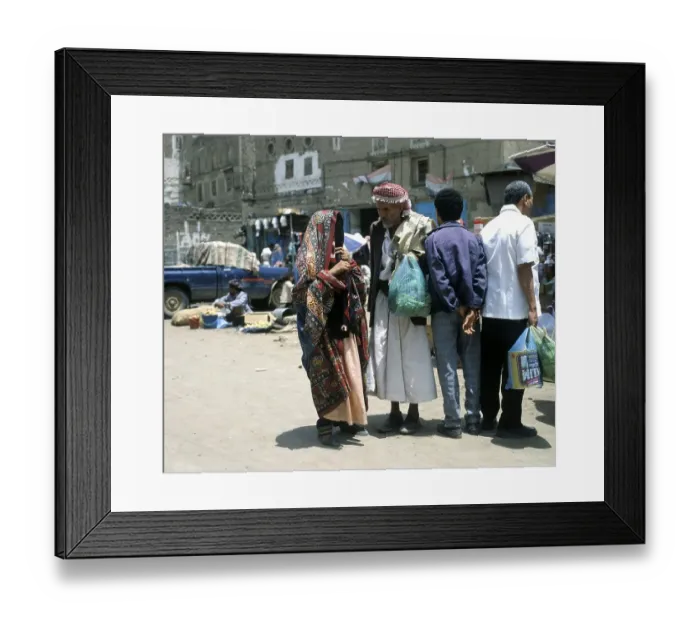 Framed Print : A woman and a man talking in the old town of Sanaa, UNESCO World Heritage Site, Sanaa, Yemen, Asia