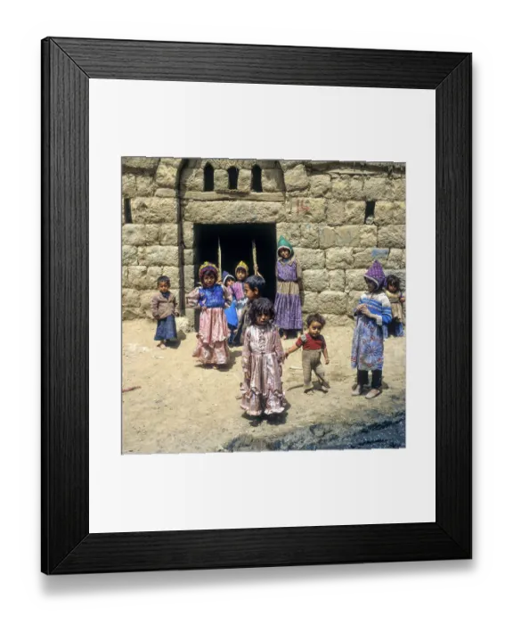 Framed Print : Children rocking in a house entrance, Amran, Yemen, Asia