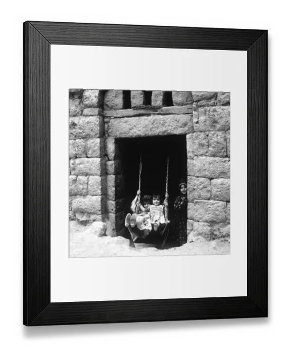 Framed Print : Children rocking in a house entrance, Amran, Yemen, Asia
