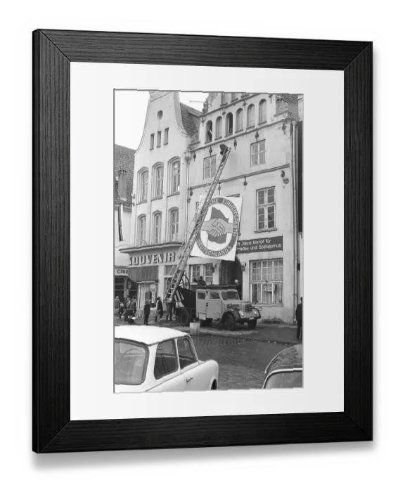 Framed Print : 13.04.1971, Rostock, Rostock district, hanging a poster in the shape of the SED party badge