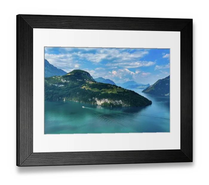Framed Print : An idyllic lake with blue water, surrounded by mountains under a cloudy sky, crossed by a boat, Morschach, Switzerland, Europe Framed Print : An idyllic lake with blue water, surrounded by mountains under a cloudy sky, crossed by a boat, Morschach, Switzerland, Europe