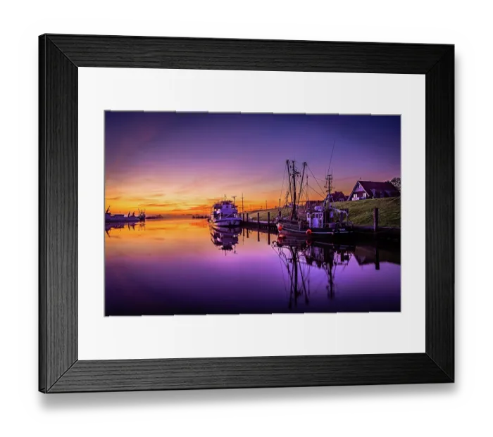 Framed Print : Shortly in front of sunrise in the harbour of Greetsiel with the anchored ships and reflection in the water, Greetsiel, Lower Saxony, Germany, Europe