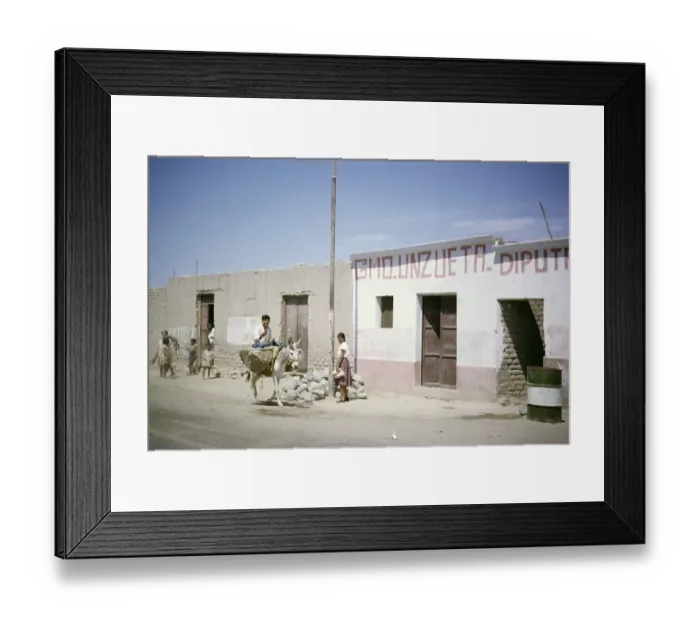 Framed Print : Boy riding a mule, mud-brick house on the street, mud-brick houses in Nazca, Peru, South America, around 1962, South America