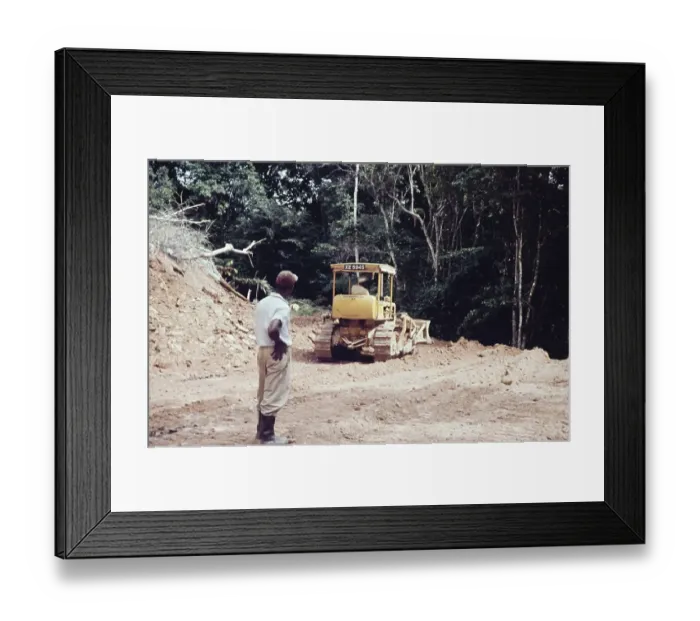 Framed Print : Caterpillar bulldozer repairing the road through rainforest blocked by landslide to Blanchisseuse, Trinidad early 1960s