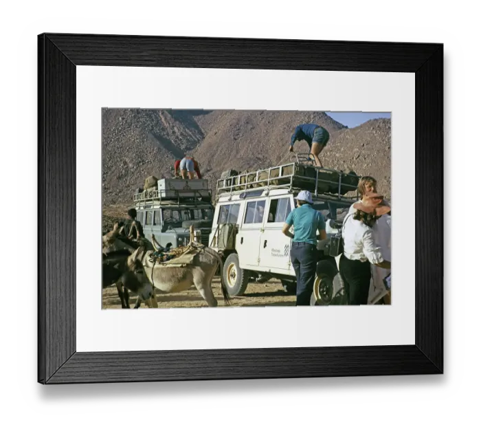 Framed Print : Unloading tourists and baggage, Landrovers of MIntrek Expeditions Ltd, Tassili N'Ajjer National Park, near Djanet, Algeria, north Africa 1973, Africa