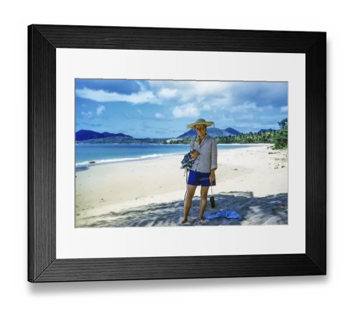 Framed Print : Female tourist wearing straw hat standing on sandy Vigie beach, St Lucia, Windward Islands, West Indies, 1962