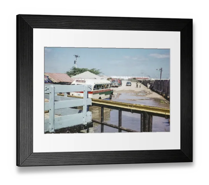 Framed Print : Bus at the ferry terminal for crossing the Rio Magdalena river, Barranquilla, Colombia, South America 1961, South America