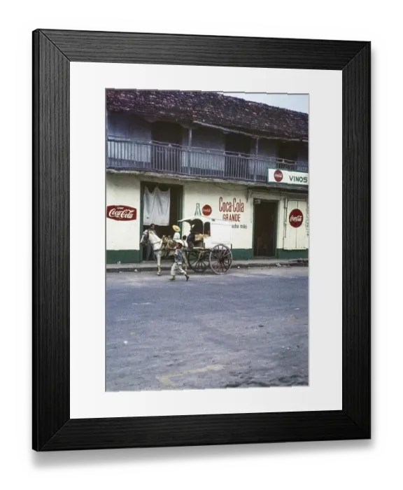 Framed Print : Coca Cola advert on the side of a cafe canteen, streets of El Progreso, Yucatan Peninsula, Mexico, 1961, Central America