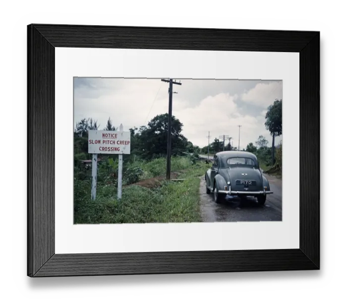Framed Print : Morris Minor car on road landward side of Pitch Lake with pitch creep crossing warning sign notice, Trinidad c 1962 Framed Print : Morris Minor car on road landward side of Pitch Lake with pitch creep crossing warning sign notice, Trinidad c 1962