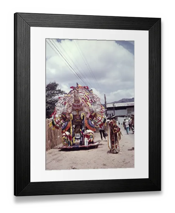 Framed Print : Caption: A lone Indian, elaborate decoration for one person at a carnival, Trinidad 1962