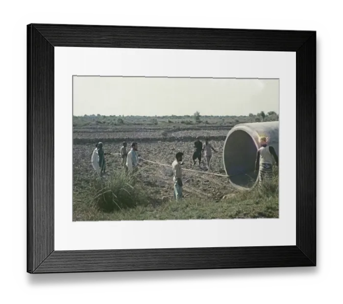 Framed Print : A large section of drainage pipe is positioned for an irrigation project in rural Pakistan in 1962 Framed Print : A large section of drainage pipe is positioned for an irrigation project in rural Pakistan in 1962
