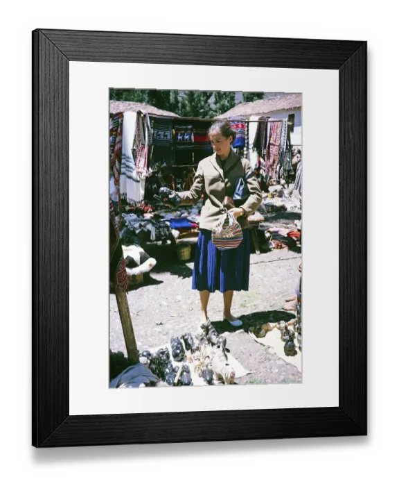 Framed Print : Tourist shopping for handicrafts at the street market in Pisac, Cusco region, Peru, South America 1962, South America